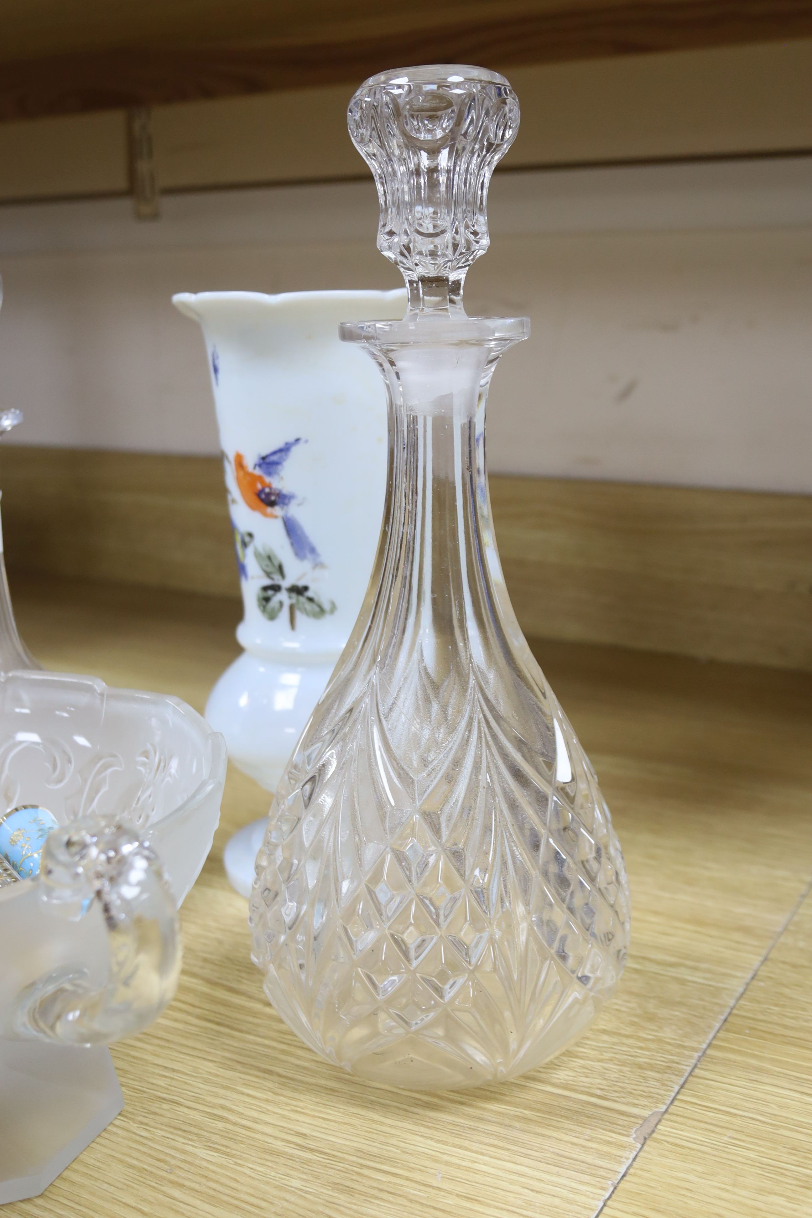 A collection of glass perfume bottles, three decanters, two scent bottles with cut glass stoppers and two handled bowl and an Art Nouveau style vase and plated cruet